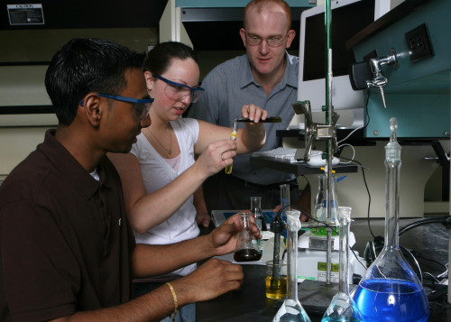 Students in a lab mixing liquids