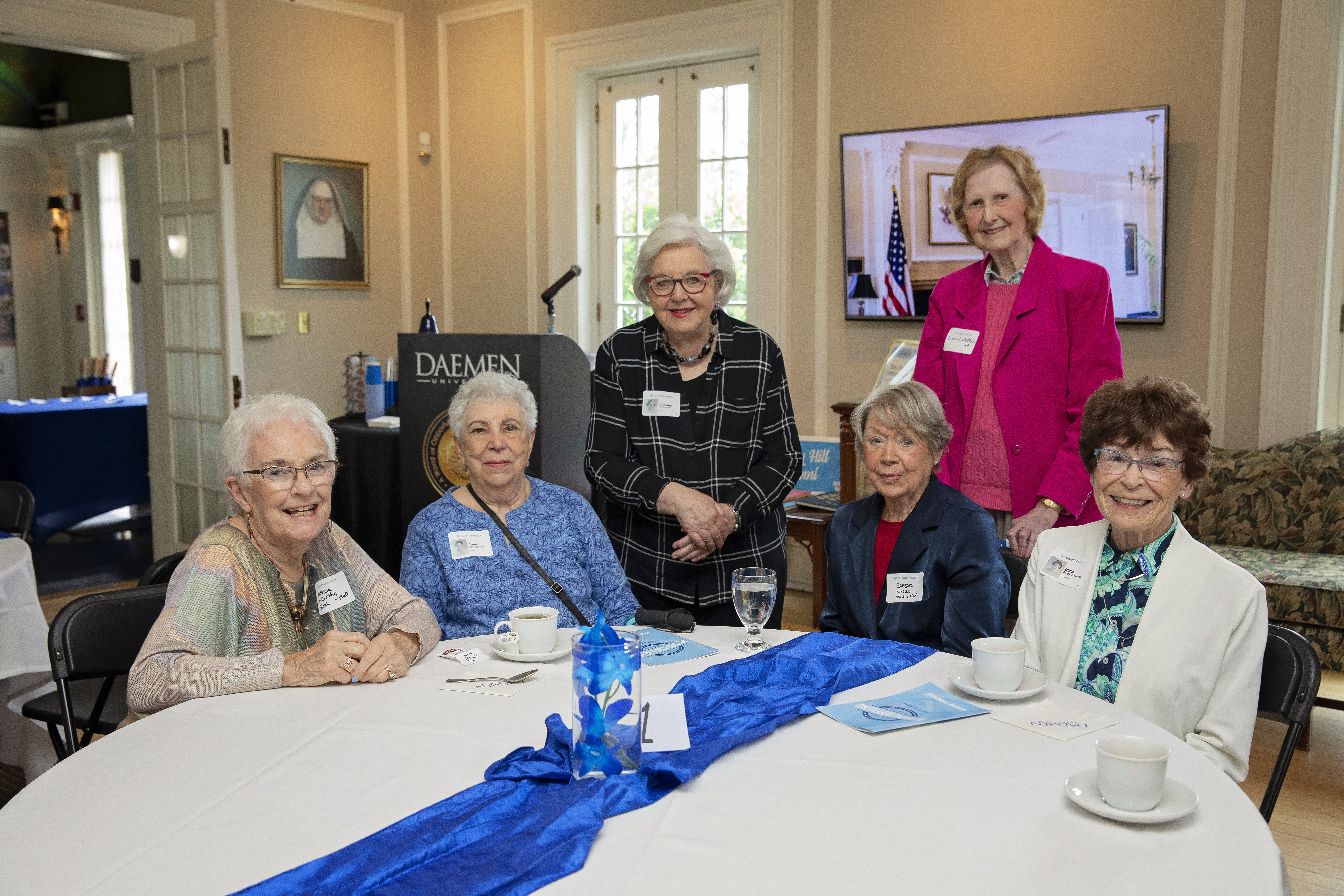 six people, sitting at table