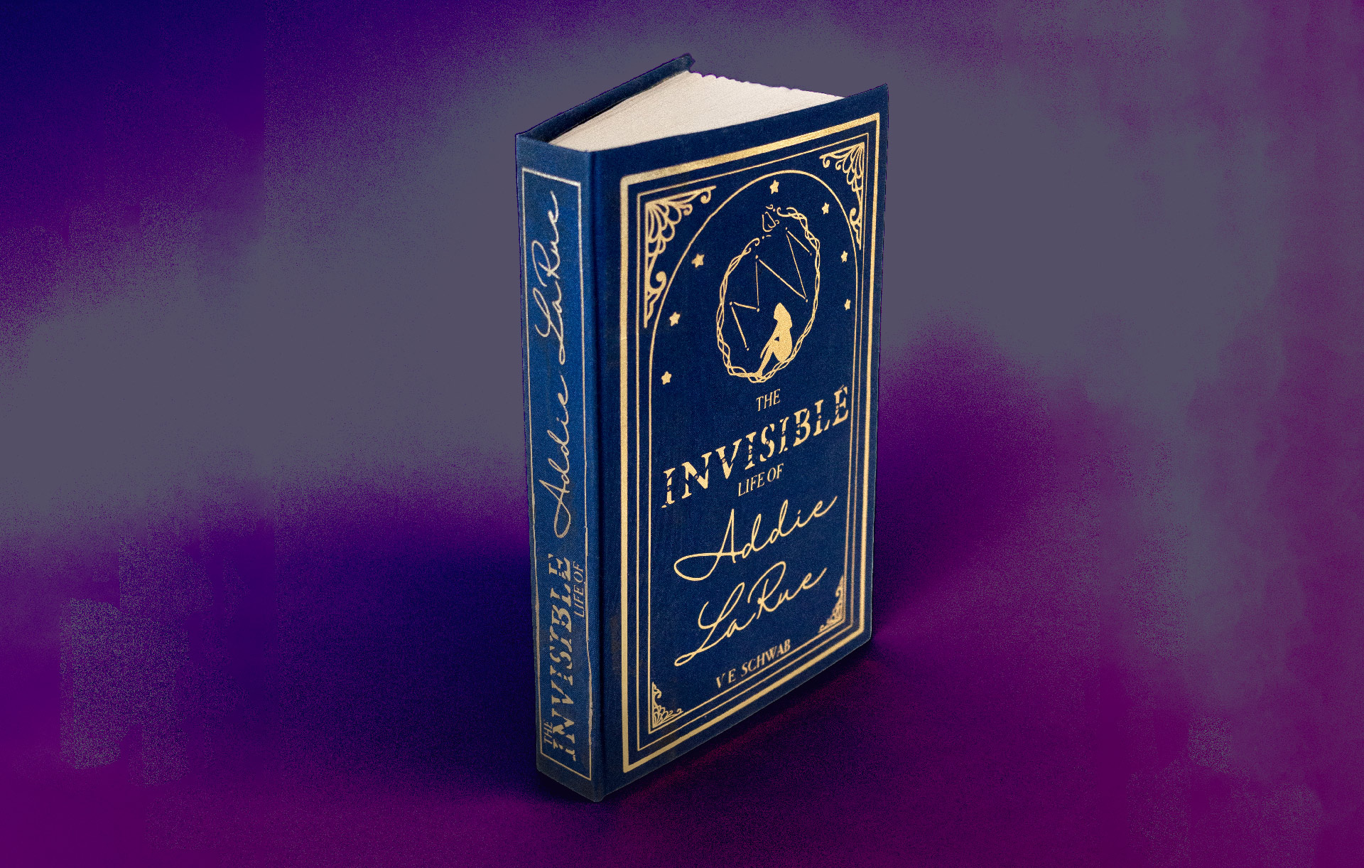 Invisible Life of Addie book cover; gold text on a dark blue cover