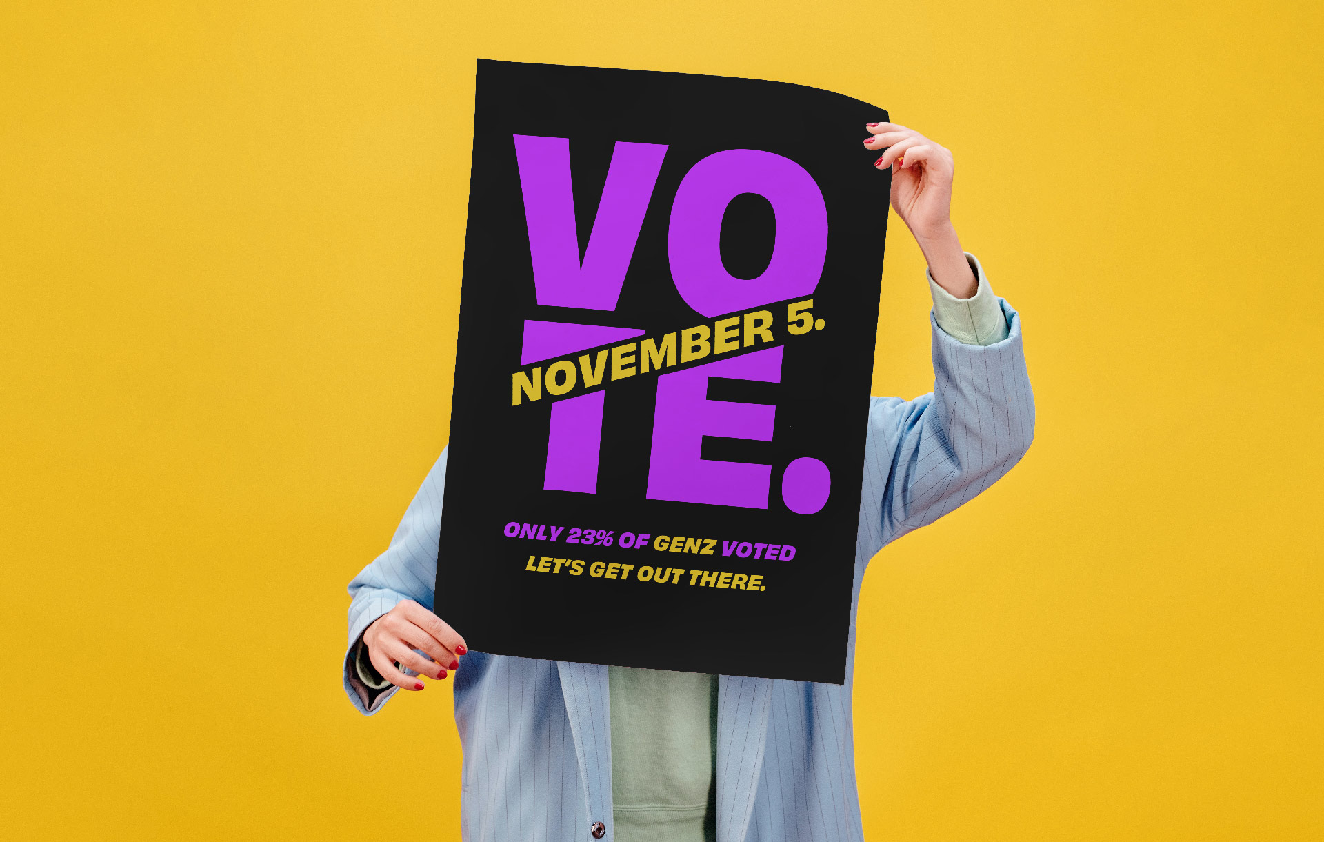 Person holding a VOTE poster