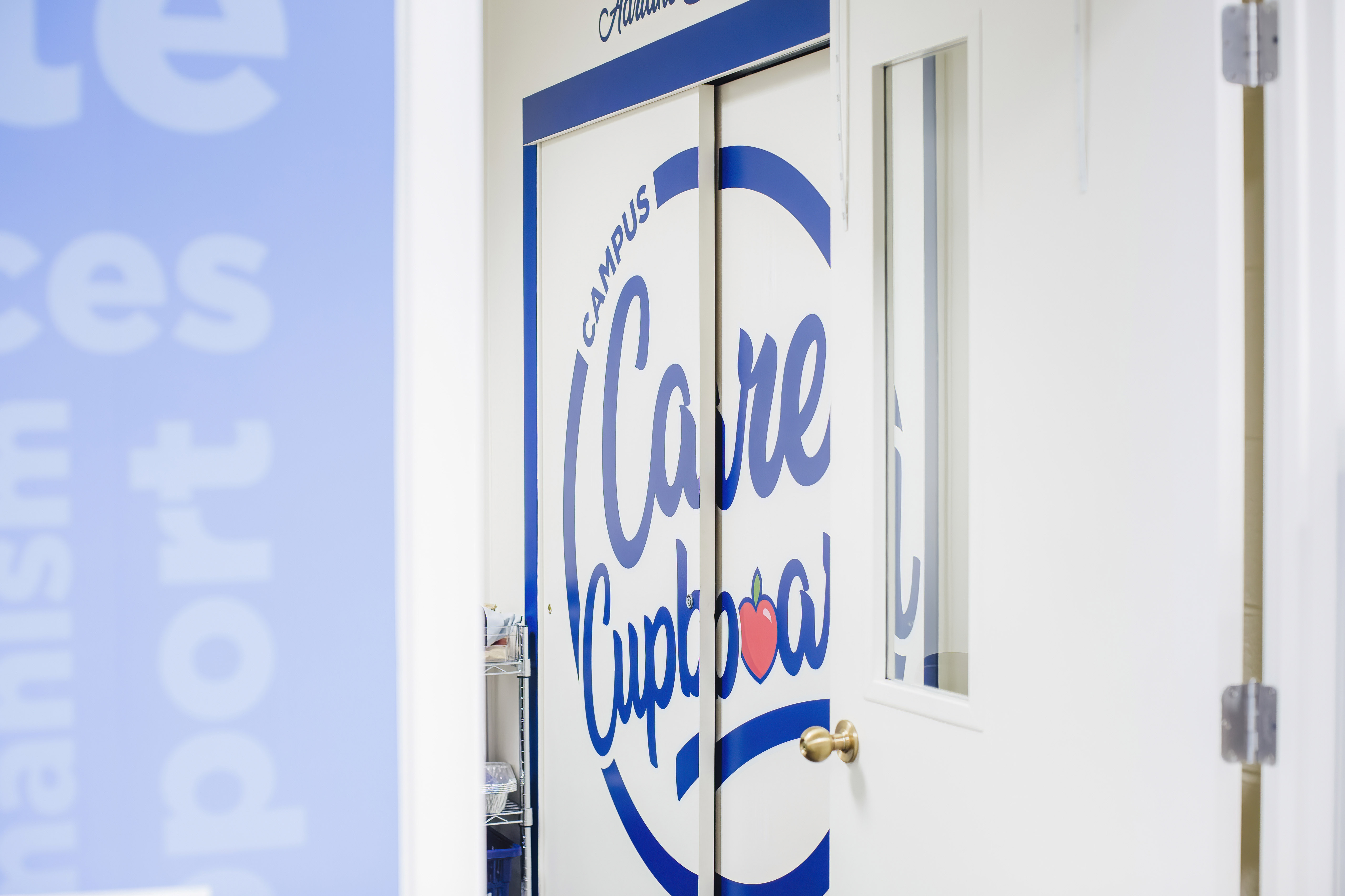 Campus Care Cupboard logo on pantry doors