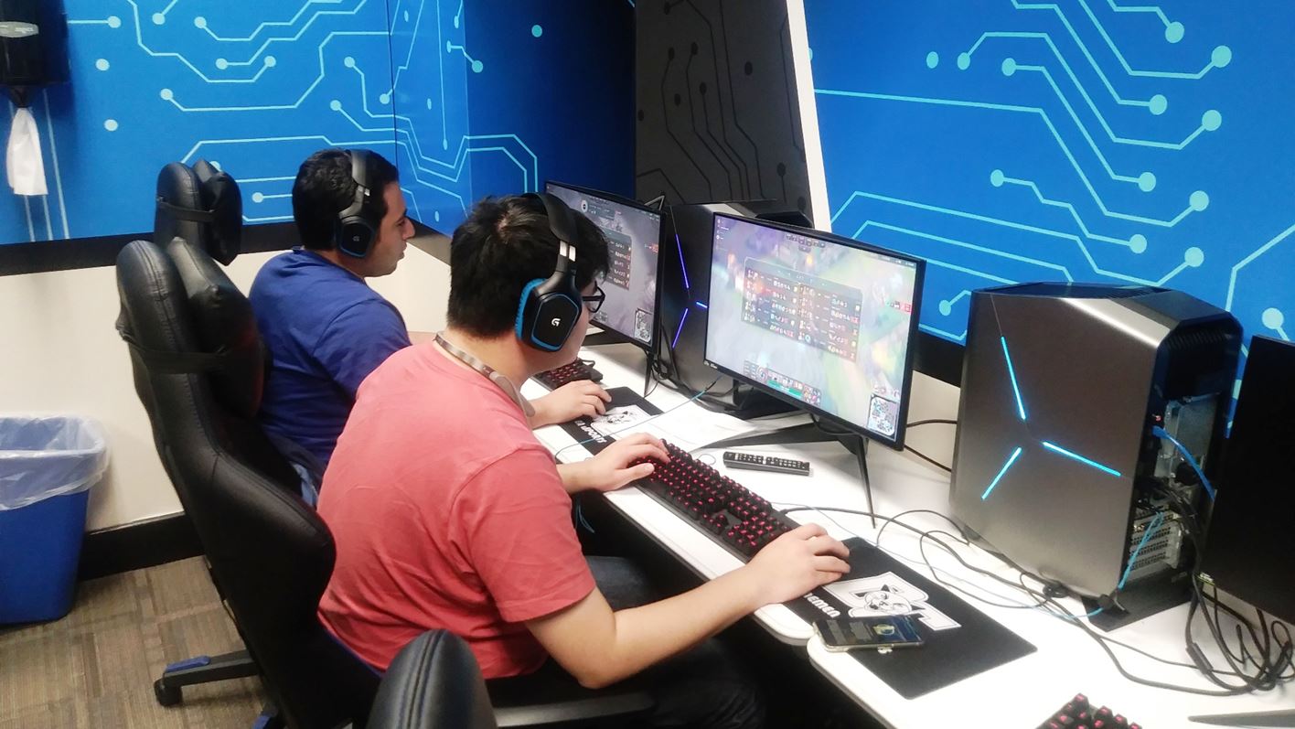 Jose Mejia and Justin Fang playing League of Legends in the esports room