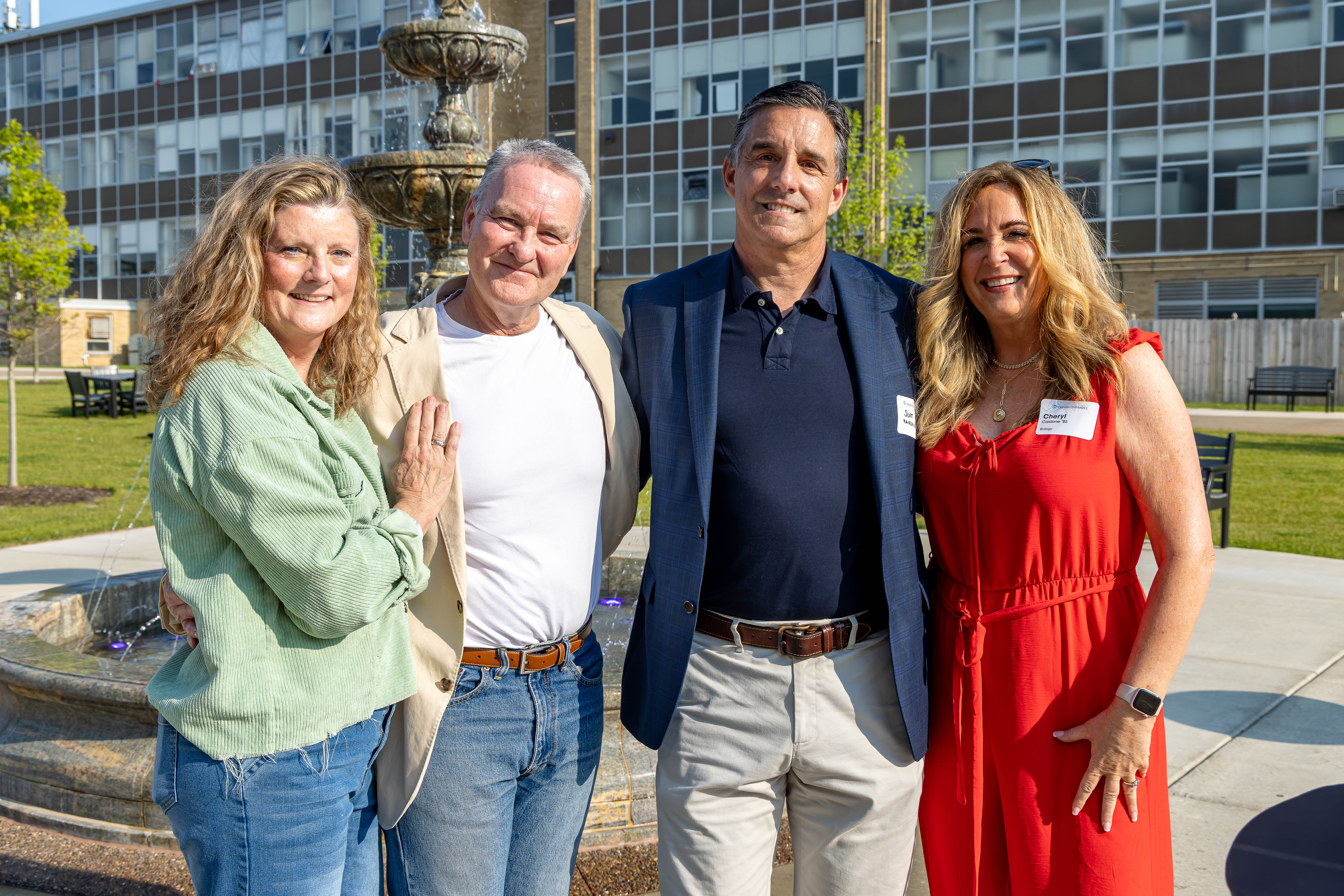 four people, outside in Daemen Square