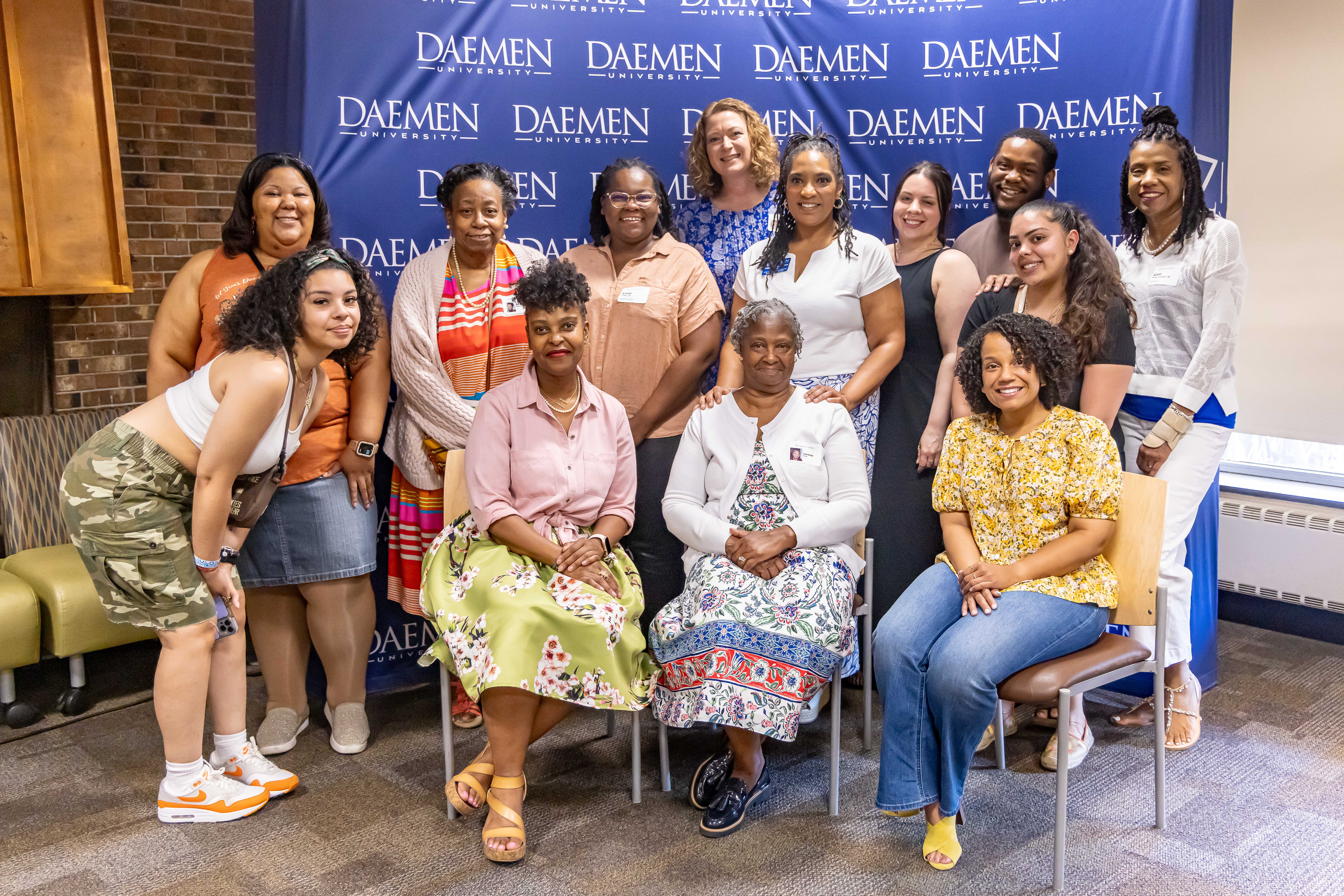 large group of people gather inside, standing and sitting