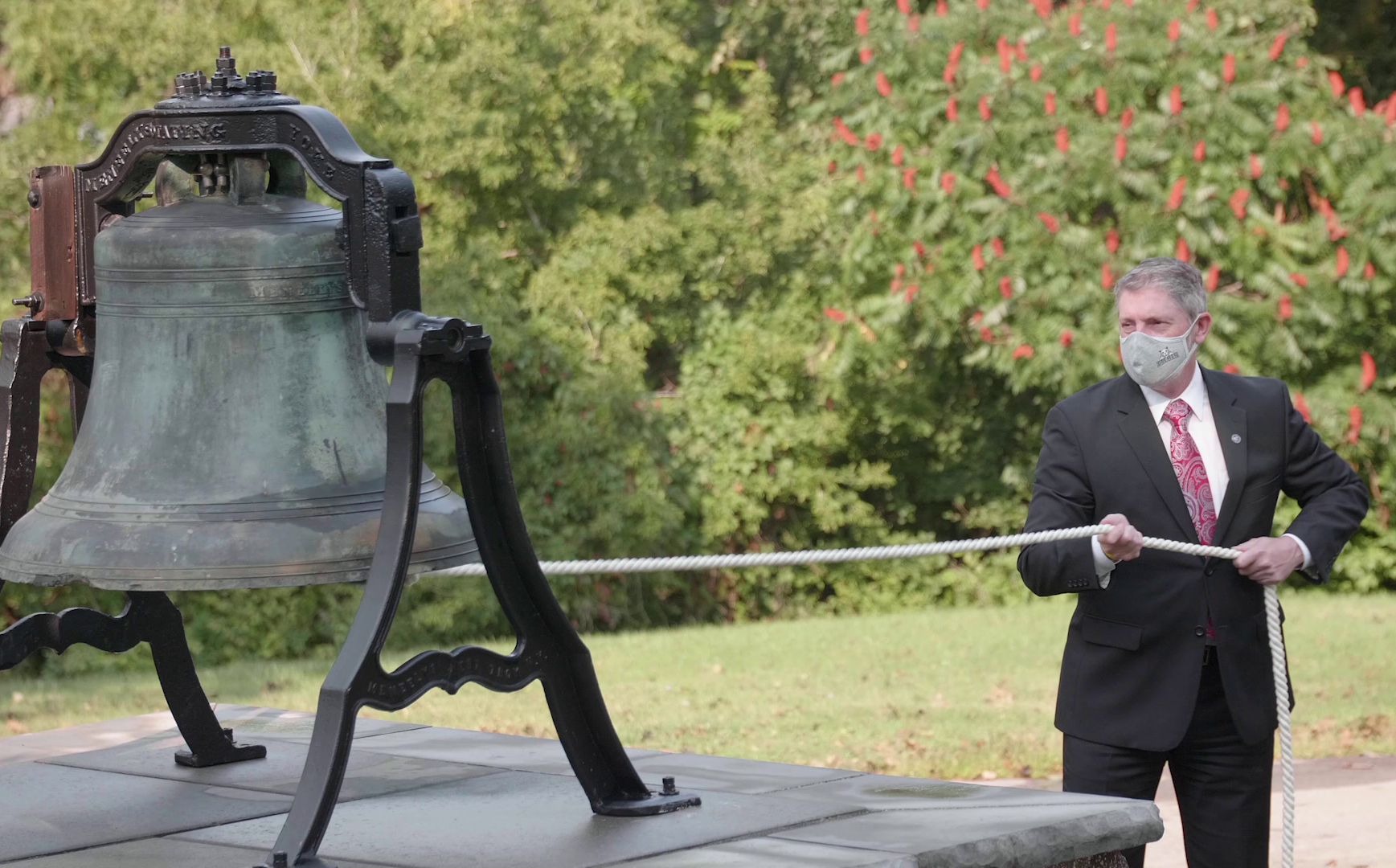 Dr. Greg Ford rings Founders Bell. 