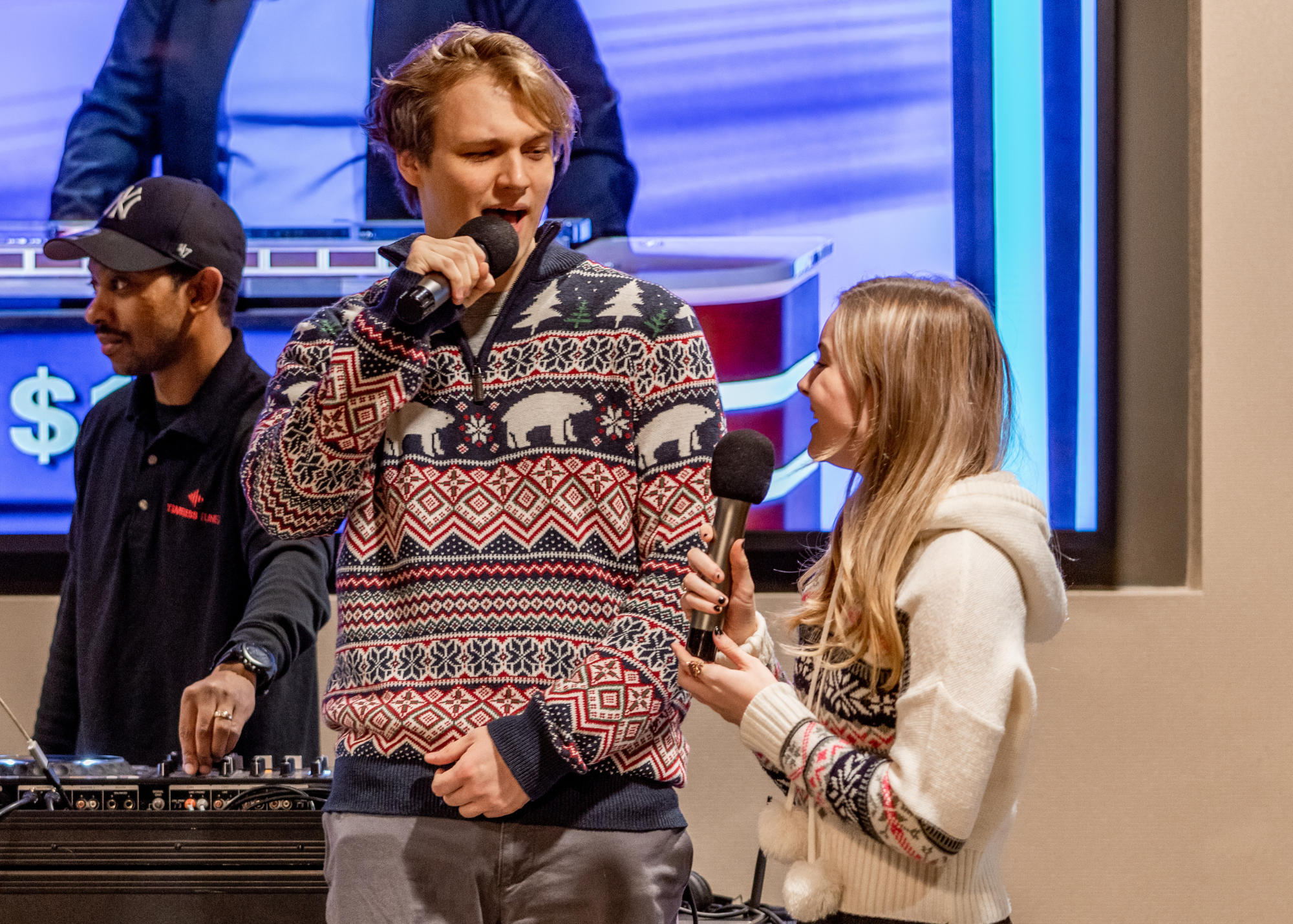 two people sing together