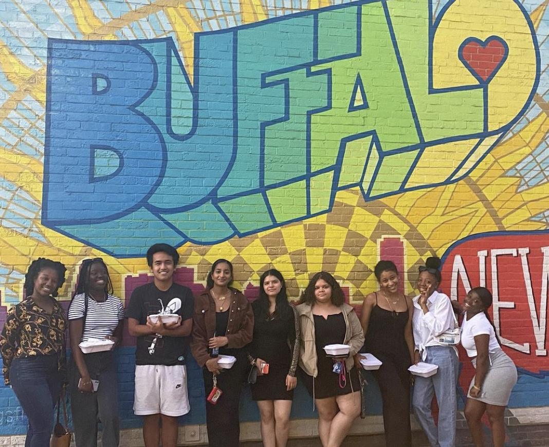 HEOP students standing by Buffalo mural 