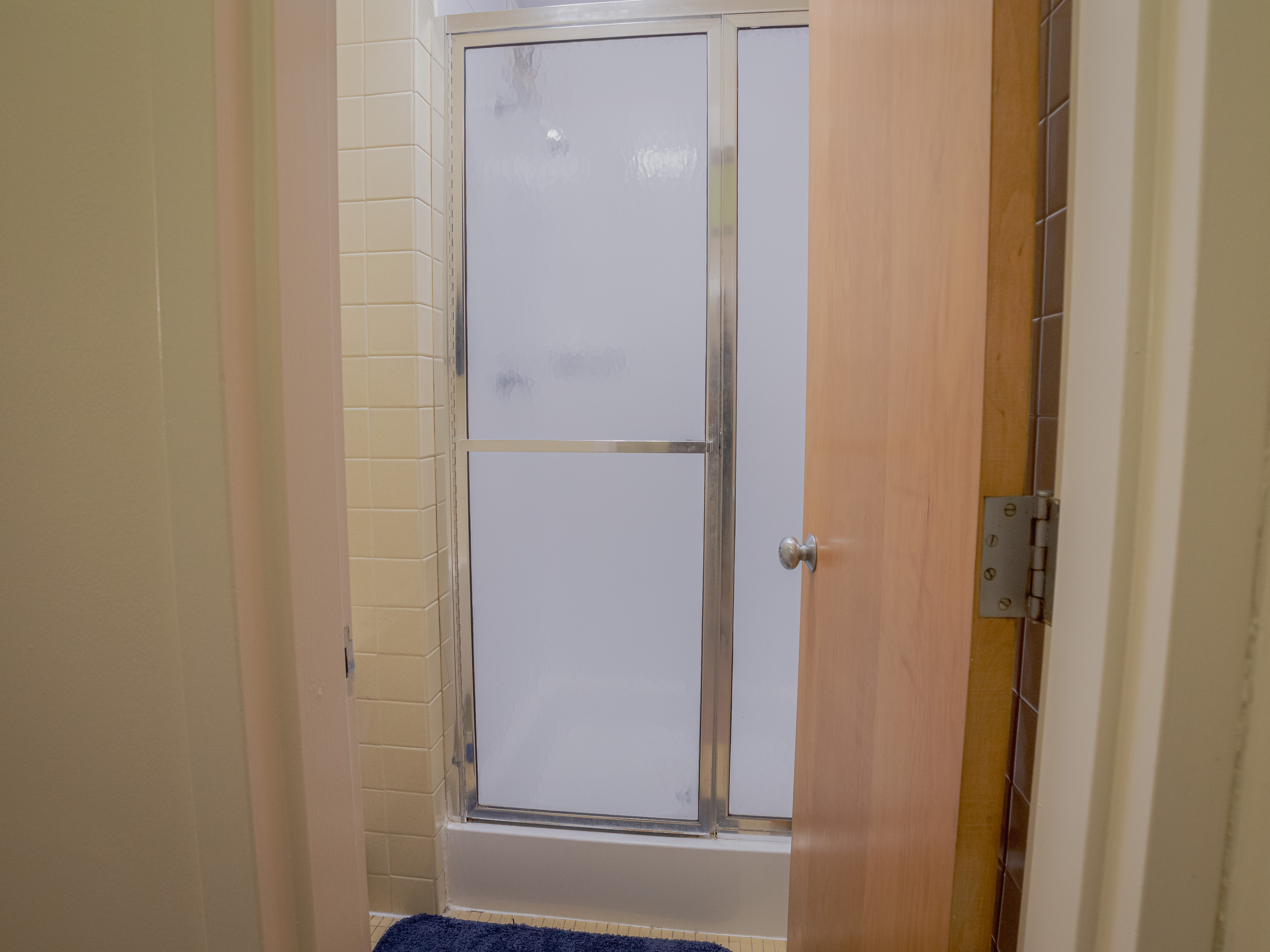 Picture of Canavan Hall shower area in bathroom.