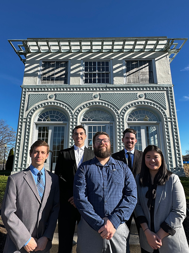 Award winners standing on the steps outside of Rosary Hall