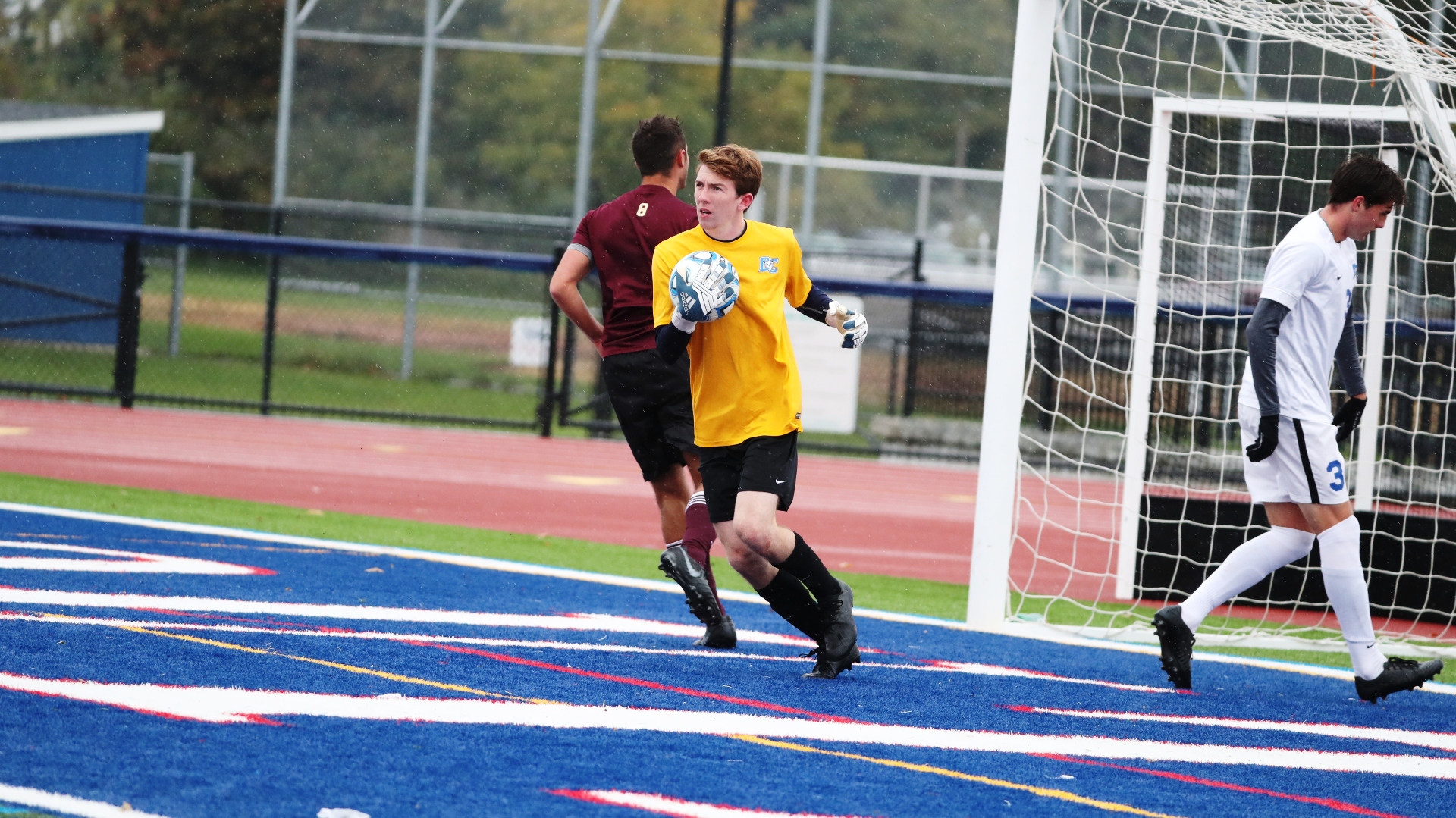 Eithan Hahn as a goalie throwing a soccer ball