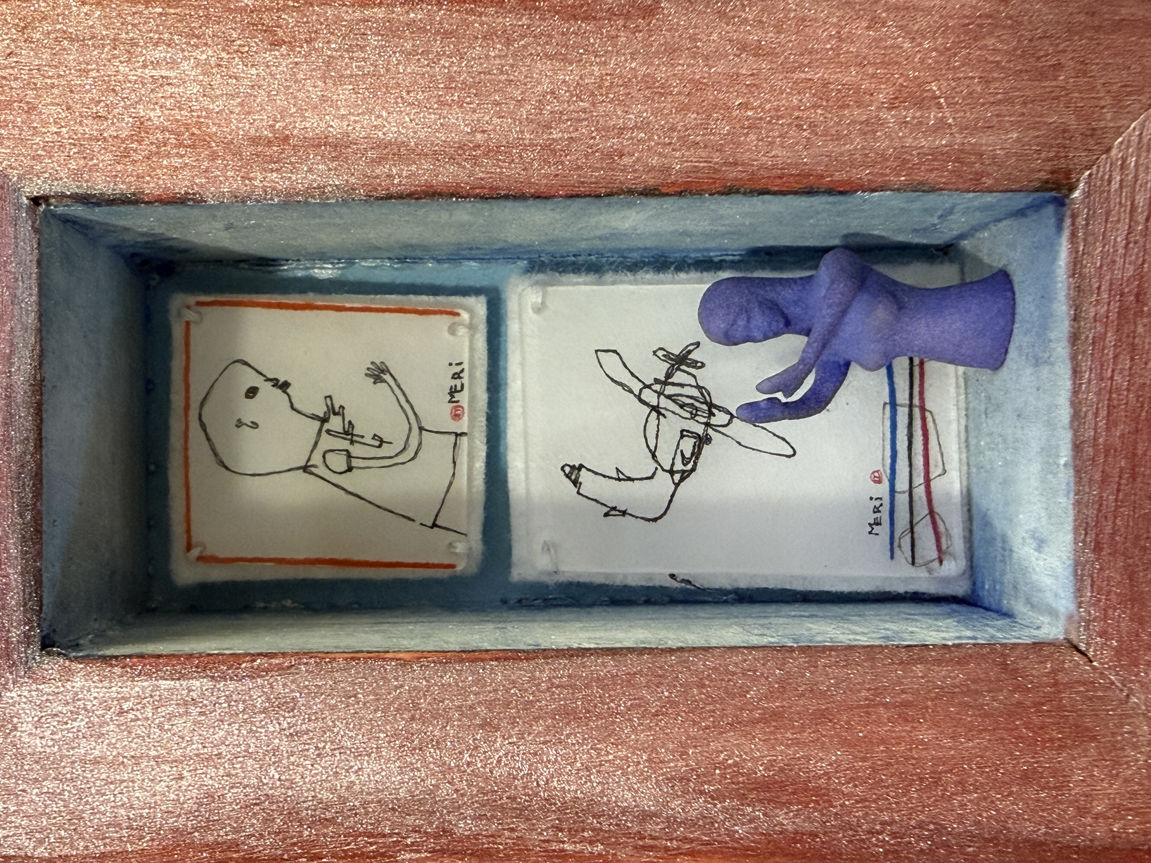 Abundance, 2024 3 x 5’, painted wooden box with drawings on heating setting plastic, and a 3d printed blue figure