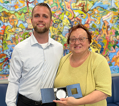 Terri Kolodziej holding an award