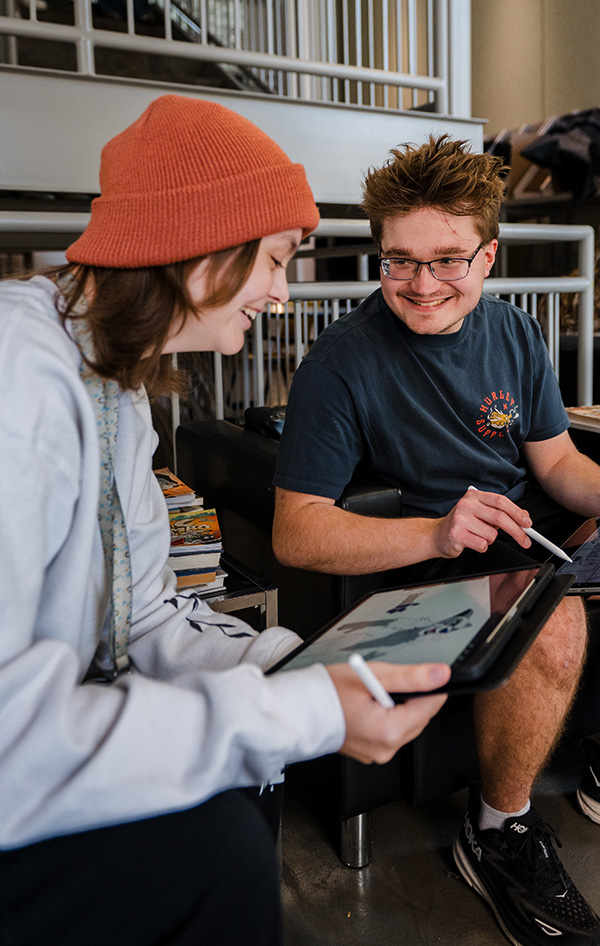 Two students drawing on tablets in Center for Visual & Performing Arts