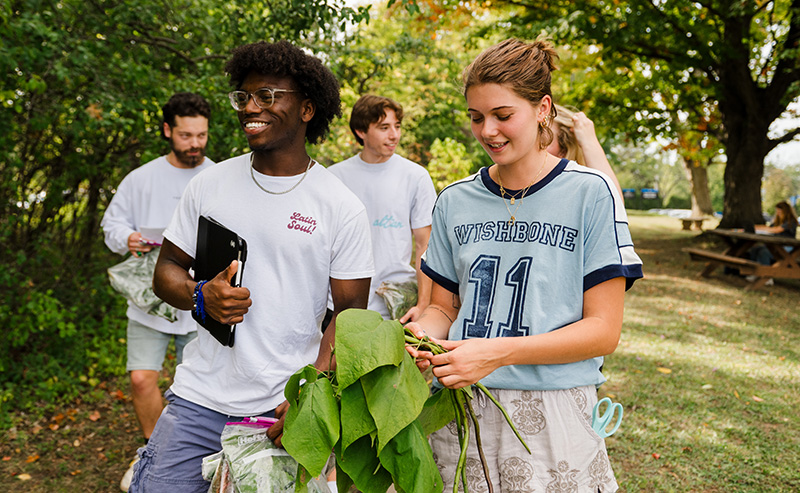 Daemen Biology students on lawn by business building