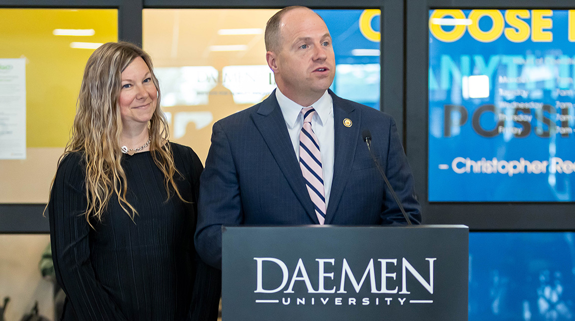 Congressman Timothy M. Kennedy behind podium
