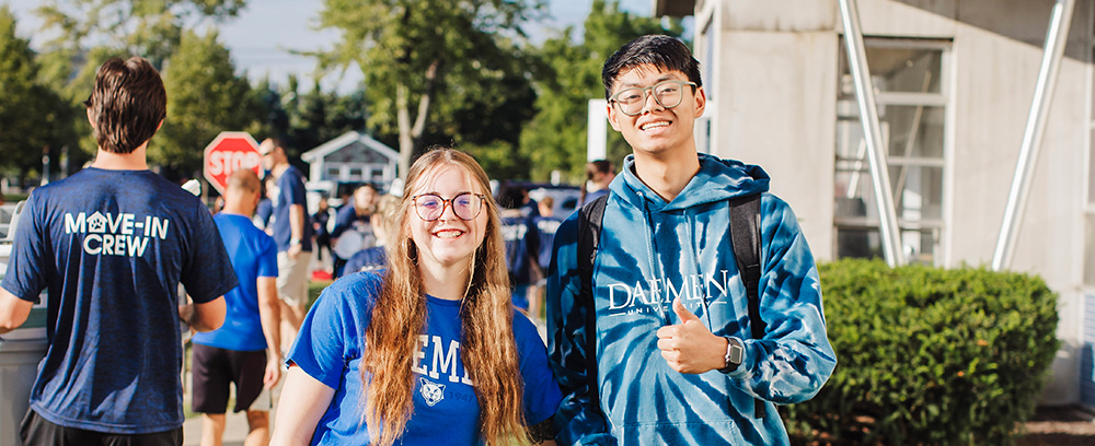 Students standing outside of Canavan hall during move in weekend 