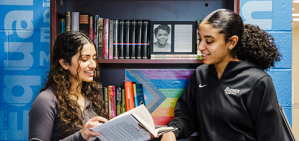 Students in HOPE center reading a book