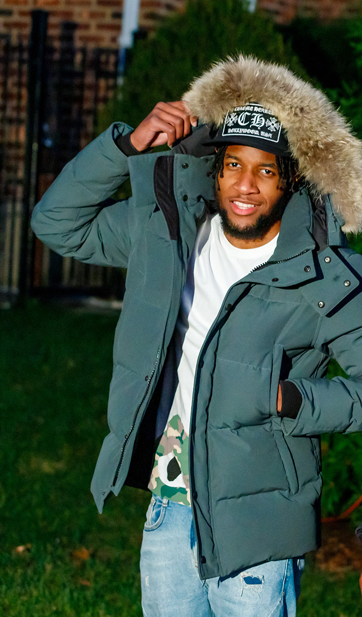 Jevon Jordan in a winter coat and hat