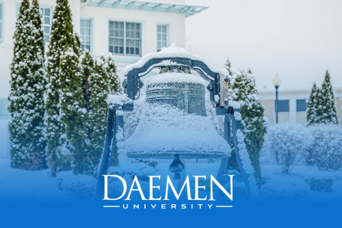 A photo of Founders Bell outside Rosary Hall after a winter snowstorm. 