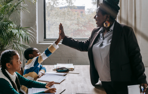 Teacher with students in classroom