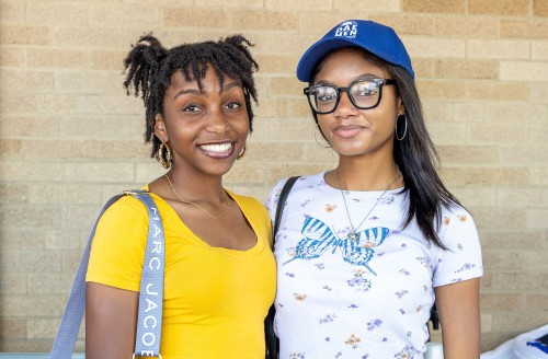 Two female students at Daemen block party