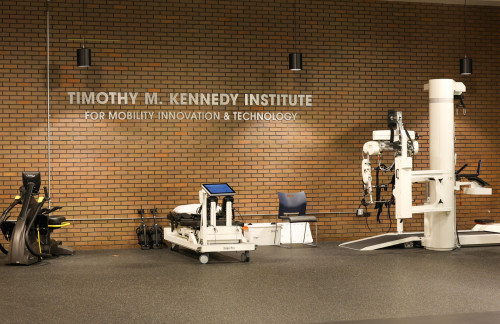 Kenny Institute interior sign with therapy equipment