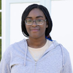 Serenity wearing a heather grey sweatshirt