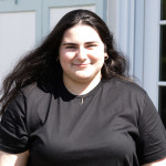 Ari wearing a black tee