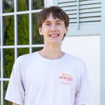 Xach Szewczyk weating a white t-shirt