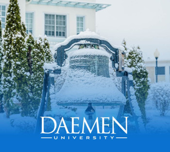 Photo of Founders bell outside Rosary Hall in the winter.