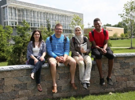 Students Sitting on Wall
