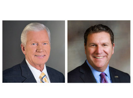 Headshots of two men, both wearing suits and ties, one with gray hair, the other with dark hair.