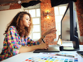 Female Student drawing on a tablet
